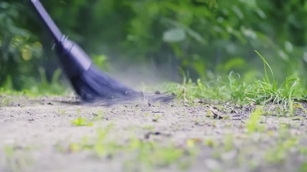 Garden Chores Footage Broom Sweeping Ground Garden Green Leaves Background — Vídeo de stock