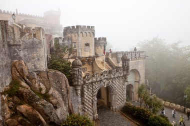 Park of the Pena palace, the fabulous alley in foggy weather, sintra, portugal clipart