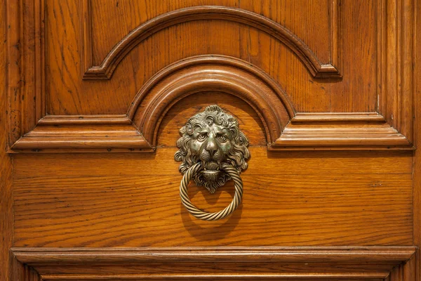 Northern Italy, ancient original door handle with sculpter decor — Stock Photo, Image