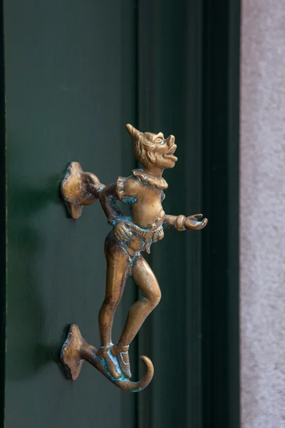 Northern Italy, ancient original door handle with sculpter decor — Stock Photo, Image