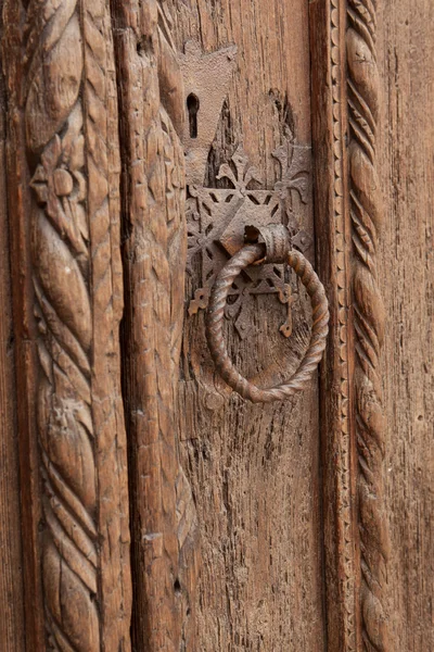 Northern Italy, ancient original door handle with sculpter décor — Stock Photo, Image