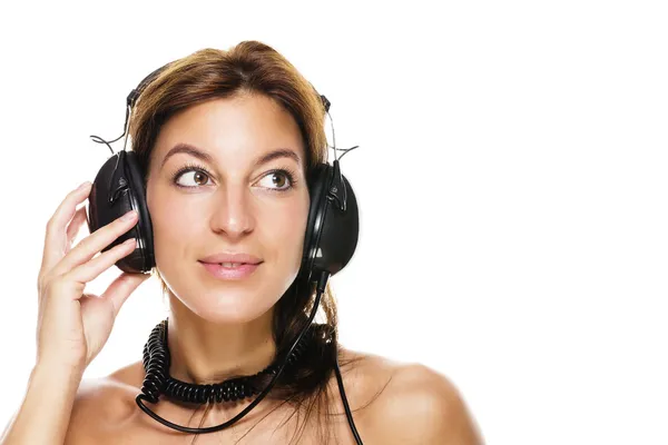 Beautiful brunette woman listening to music — Stock Photo, Image