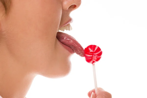 Tongue licking lollipop — Stock Photo, Image