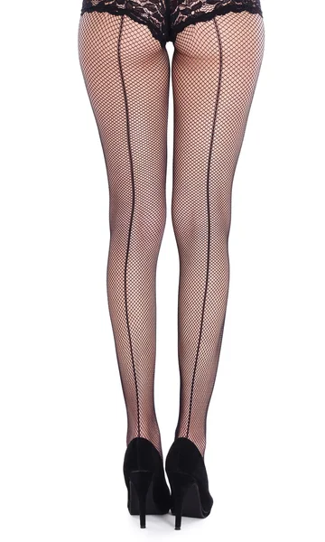 Legs from behind in fish-net stockings — Stock Photo, Image