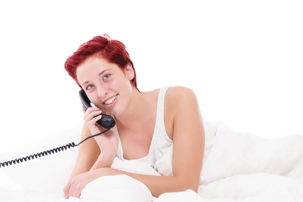 Telefonní hovor v posteli — Stock fotografie
