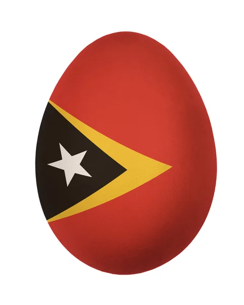 Colorato Timor Est bandiera uovo di Pasqua isolato su sfondo bianco — Foto Stock