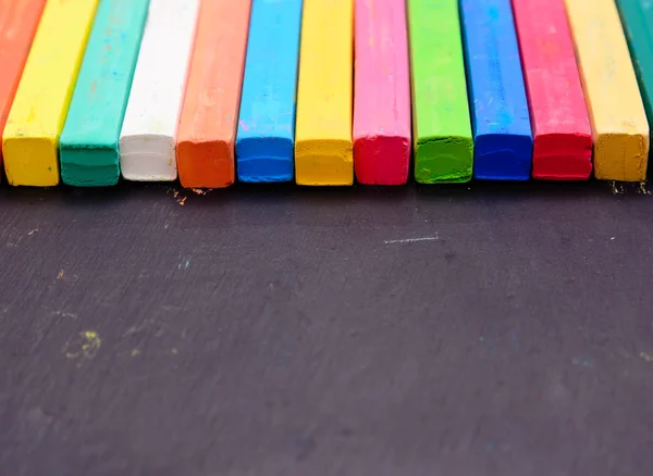 Colorful chalk on blackboard — Stock Photo, Image