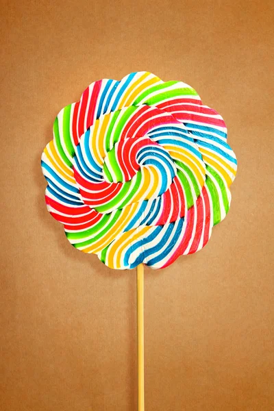 Colorful retro style lollipop isolated on brown paper — Stock Photo, Image