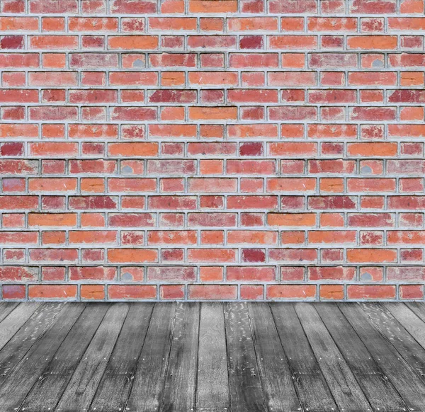 Bruin rode bakstenen muur en zwarte houten vloer achtergrond — Stockfoto