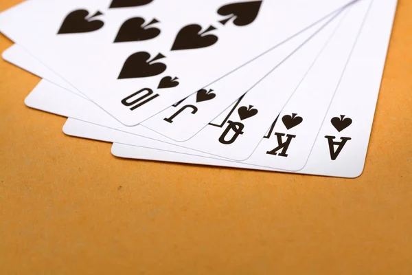 Black spade royal straight flush poker card — Stock Photo, Image