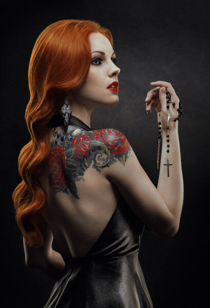 : Posh redhead woman in black dress