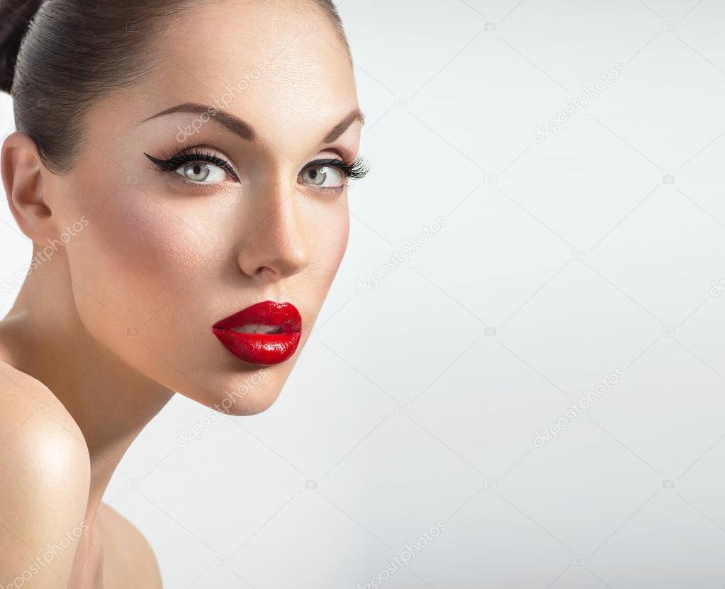 Portrait of sexy woman with red lips and perfect skin