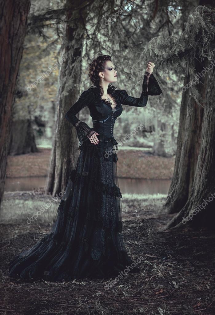 https://st.depositphotos.com/1013193/2787/i/950/depositphotos_27871013-stock-photo-woman-in-forest-in-black.jpg