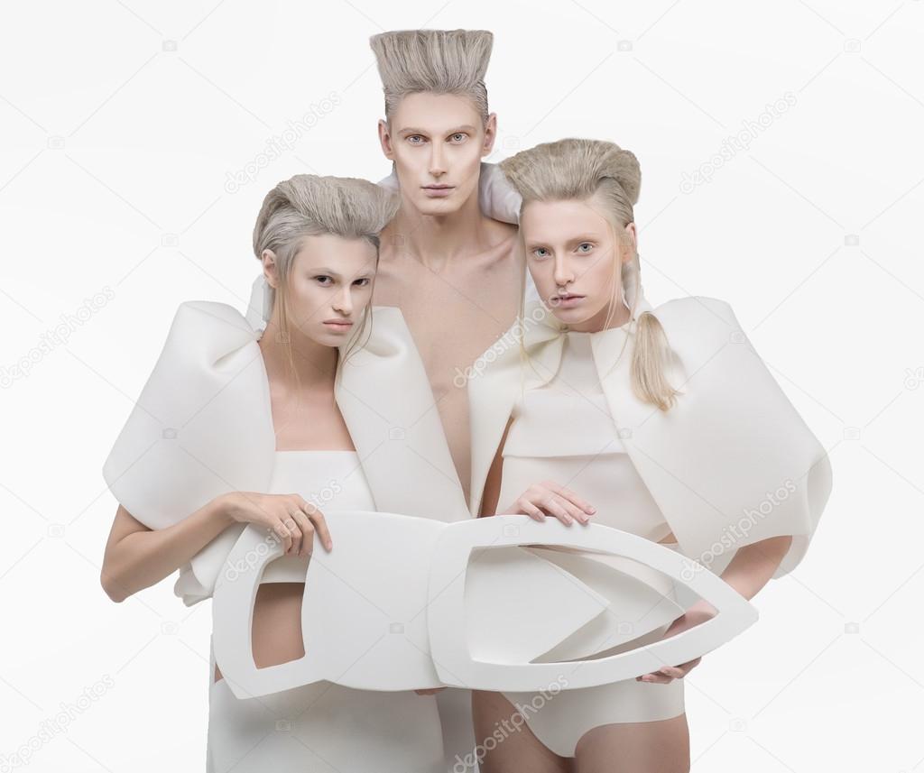 Three persons in white outfit