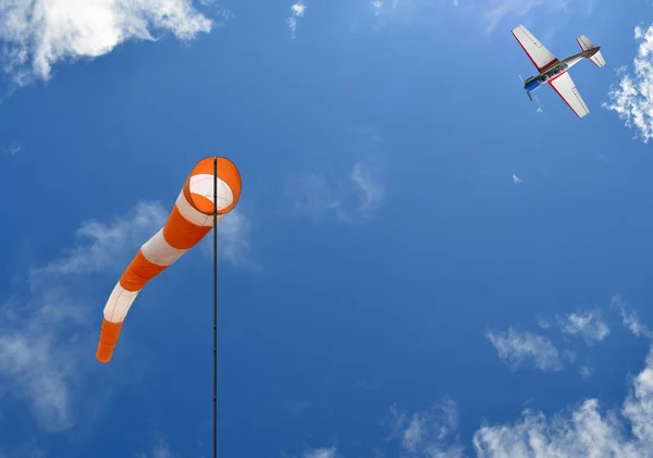 Windsock and airplane — Stock Photo, Image