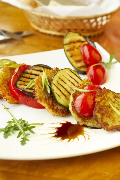 Grilled vegetables and potato fritters — Stock Photo, Image