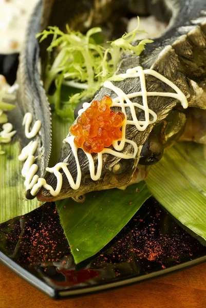 Sturgeon in creamy sauce with red caviar — Stock Photo, Image