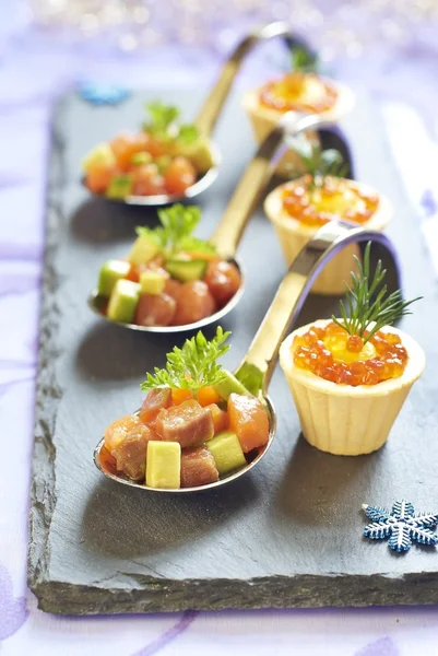 Holiday appetizers with salmon and red caviar — Stock Photo, Image