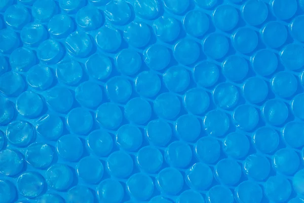 Blue plastic bubble wrap texture. — Stock Photo, Image