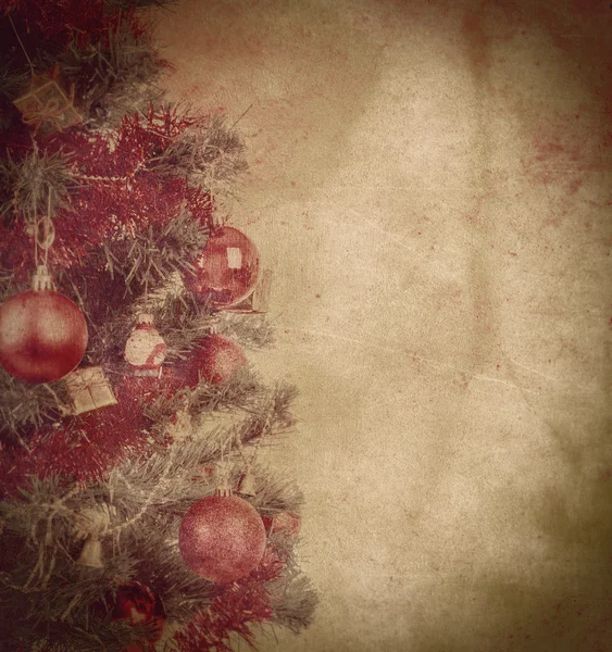 Grunge christmas background with balls on tree — Stock Photo, Image