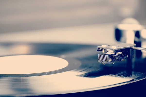 Spinning vinyl record. Motion blur image. Vintage toned. — Stock Photo, Image