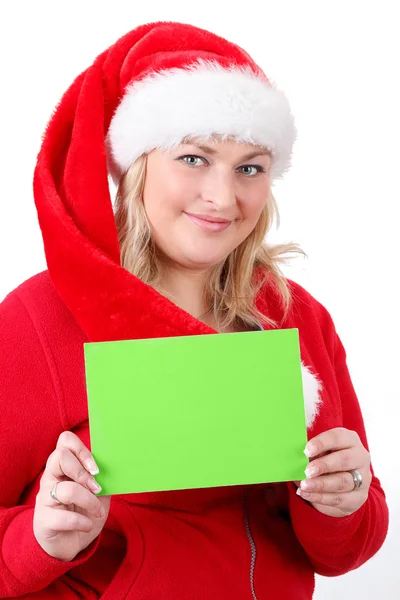 Fröhliche hübsche Weihnachtsfrau mit leerem Schild — Stockfoto