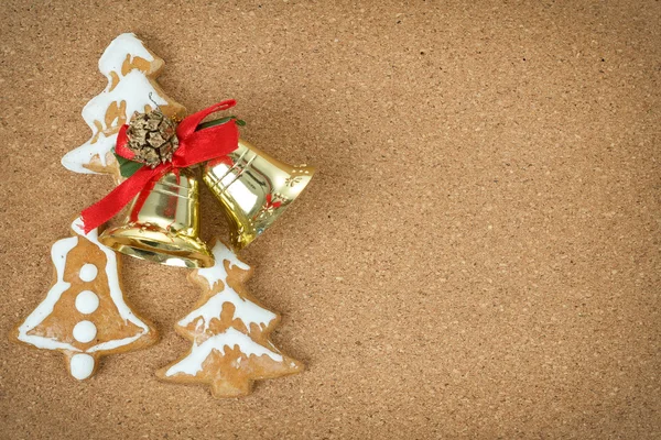 Corcboard with ginger bread and christmas bells — Stock Photo, Image