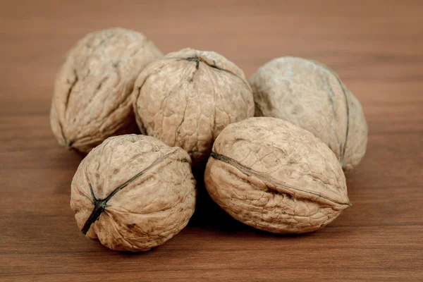 Walnuts on wooden background — Stock Photo, Image