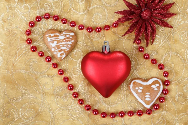 Red heart on christmas tablecloth — Stock Photo, Image