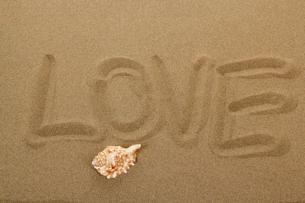 Love message written in sand — Stock Photo, Image