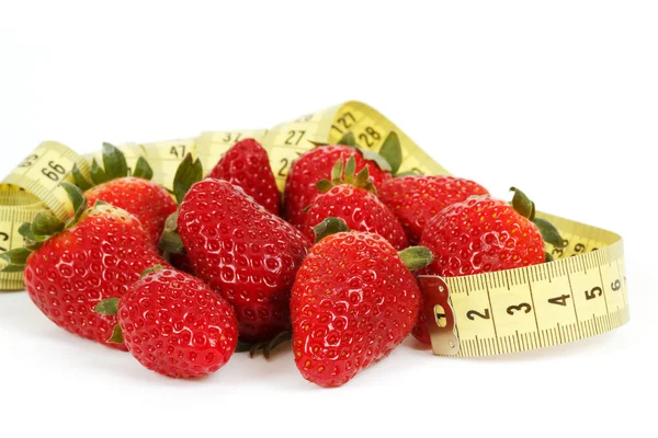 Measuring tape around a strawberry as a symbol of diet — Stock Photo, Image