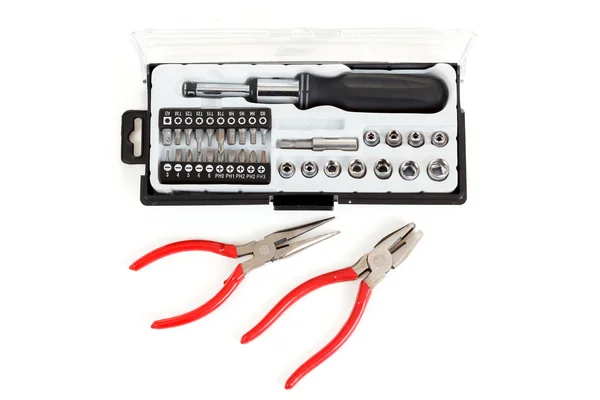 Screwdriver Bit Set with pliers on white — Stock Photo, Image