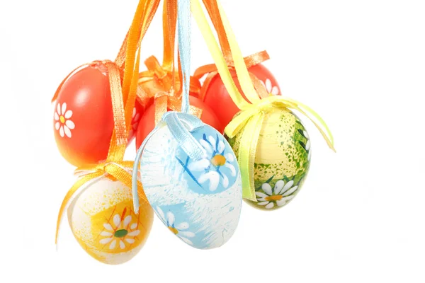 Hanged bright color easter eggs with bows — Stock Photo, Image