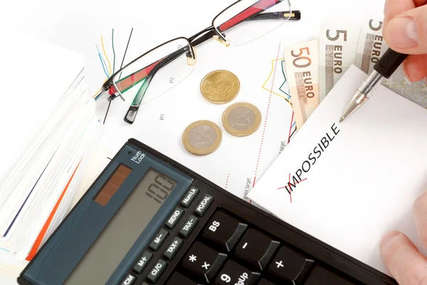 Changing impossible word to possible, calculator, charts, pen in hand, money, workplace businessman — Stock Photo, Image