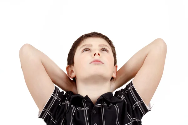 Portrait of boy on white background, smiling, he looks up — Stock Photo, Image