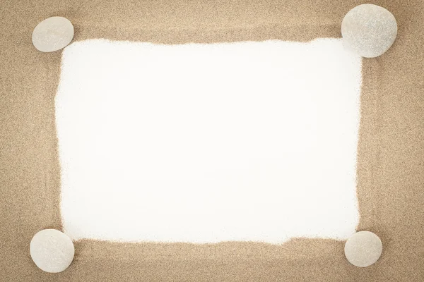 Stones with sand and white paper as background — Stock Photo, Image