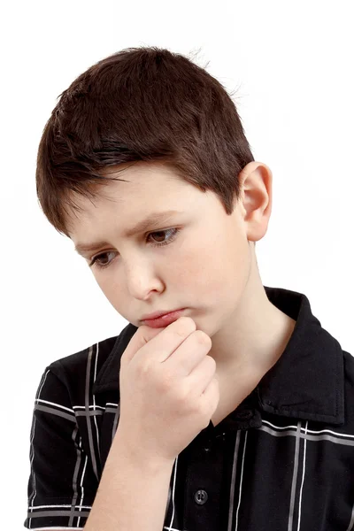 Pensive young boy isolated on white background — Stock Photo, Image