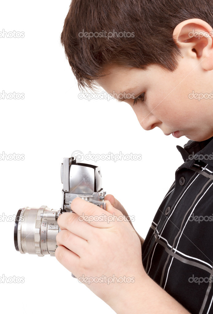 young boy with old vintage analog SLR camera