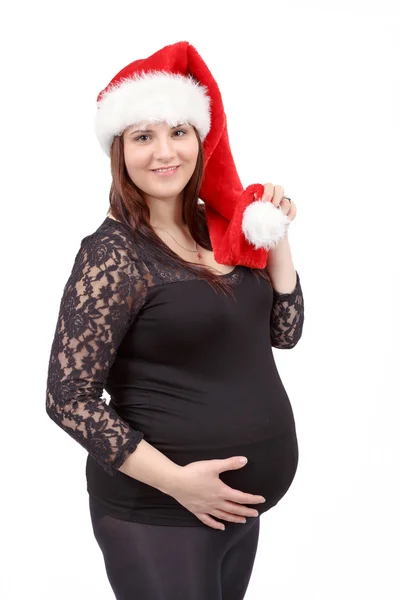 Piękna kobieta w ciąży czule trzymając jej brzuch na tle — Zdjęcie stockowe