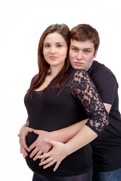 Loving happy couple, pregnant woman with her husband, isolated o — Stock Photo, Image