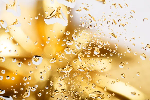 Golden abstract background with water drops — Stock Photo, Image