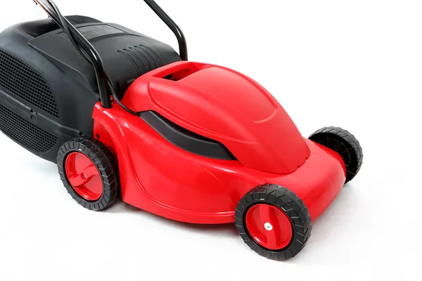 New red lawnmower on white background — Stock Photo, Image