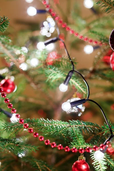 Christmas decoration on tree with light — Stock Photo, Image