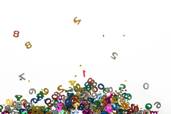 Small color numbers confetti on white — Stock Photo, Image