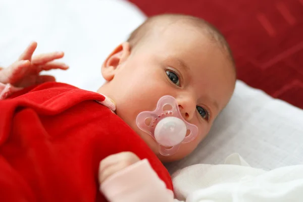 Baby in red dress — Stock Photo, Image