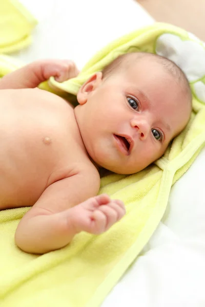 Infant wrapped in a towel after bath — Stock Photo, Image
