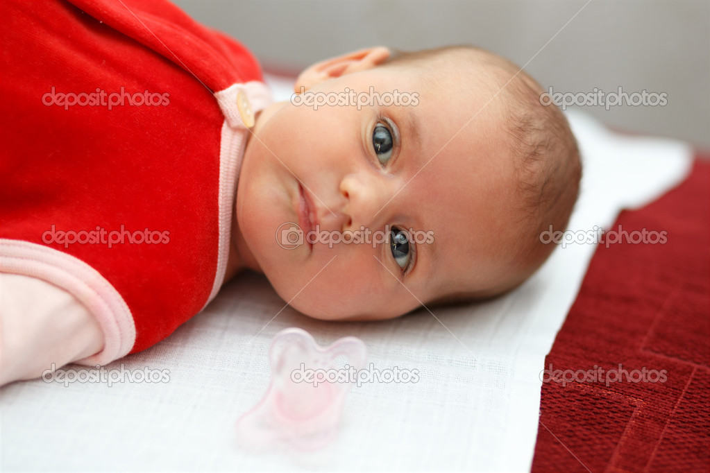 baby in red dress