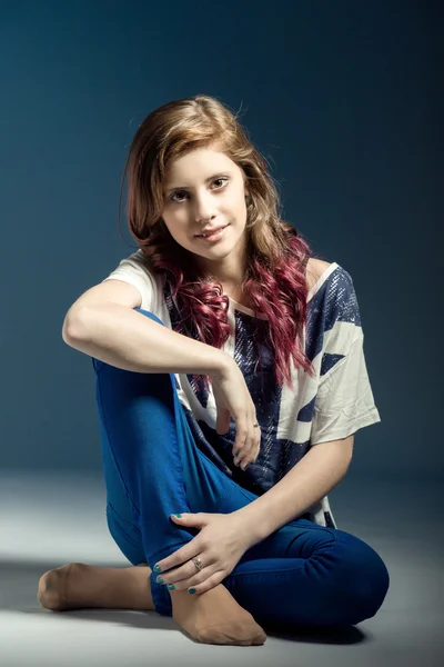 Sitting fashion portrait of young beautiful girl — Stock Photo, Image