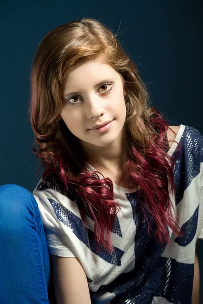 Sitting fashion portrait of young beautiful girl — Stock Photo, Image