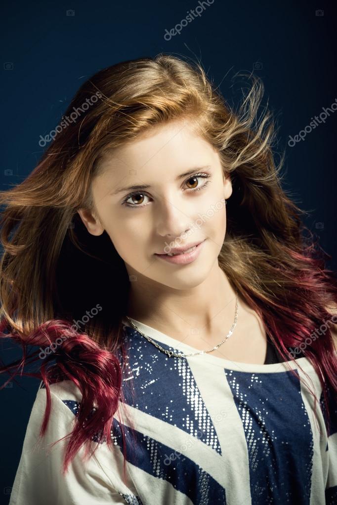 Studio portrait of young beautiful girl Stock Photo by ©artush 48445105